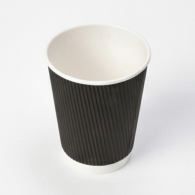 12oz Black Ripple Wall Paper Cup from three-quarter above, showing the open interior and black ripple exterior on light grey