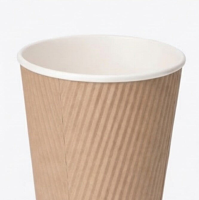 Close-up from above of the white rim and open interior of a 12oz kraft ripple wall paper cup on light grey