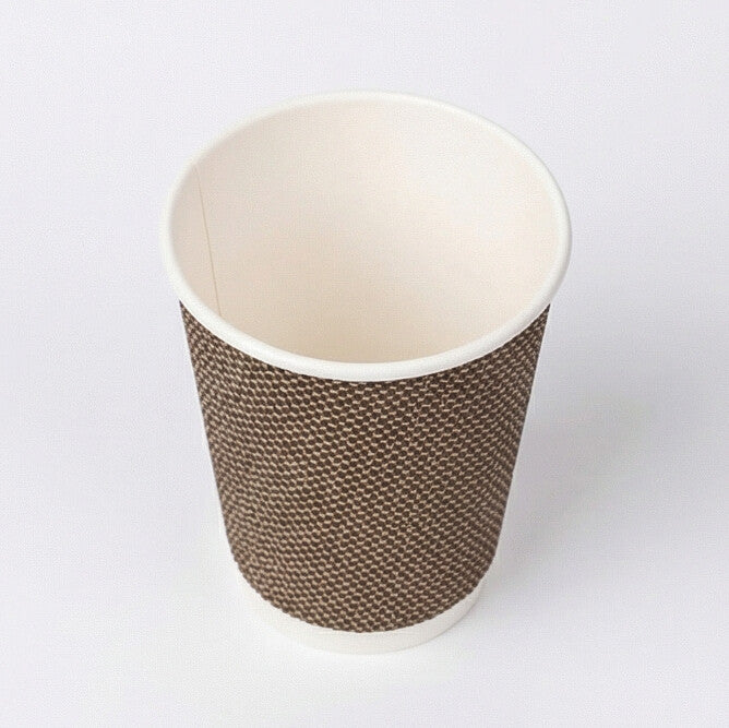 Three-quarter above view of an empty 12oz VIP Ripple Wall Paper Cup showing the interior and woven exterior on grey