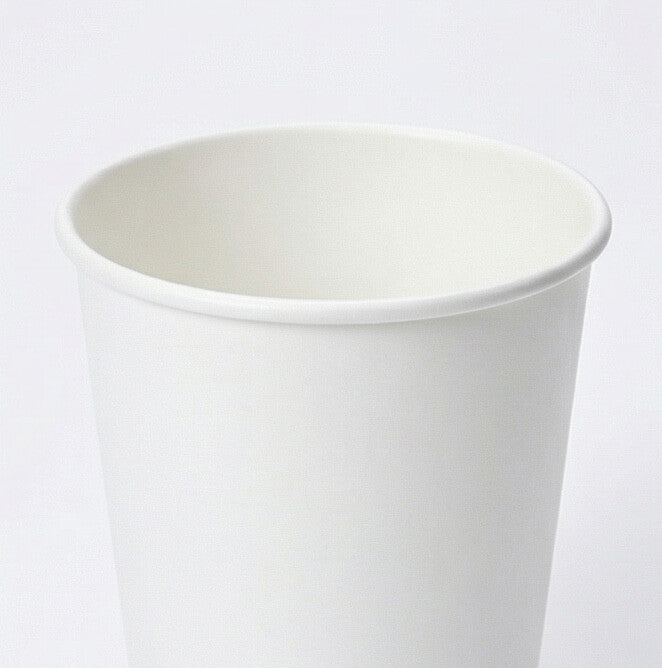 Close-up of the white rolled rim and open interior of a 12oz double wall paper cup from the side, light grey background