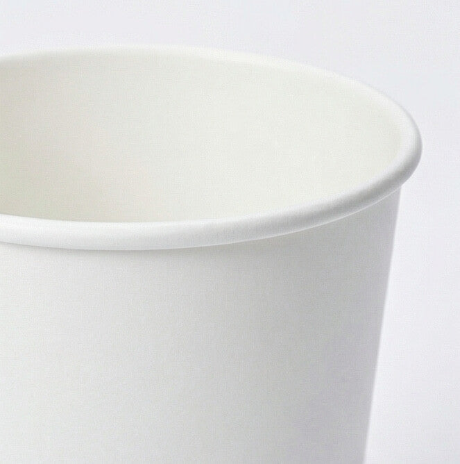 Close-up of the rolled white rim and upper exterior of a 12oz double wall paper cup on a light grey background