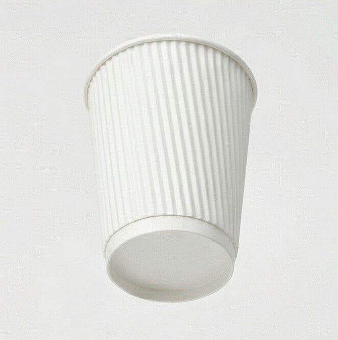 12oz white ripple wall paper cup tilted back showing the base and ripple exterior from slightly above, light grey