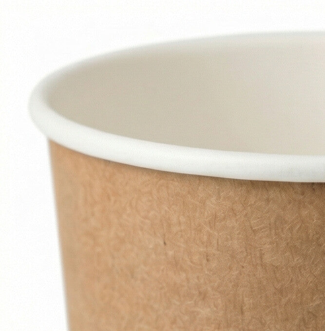 16oz compostable kraft double wall paper cup - close-up of rim and kraft paper texture on white background