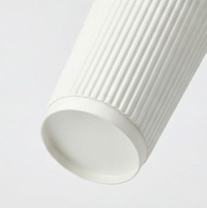 Close-up of the base ring and lower ripple texture of a 16oz white ripple wall paper cup from near-horizontal angle