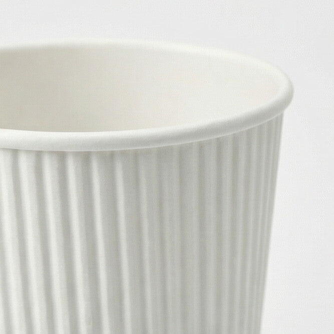 Close-up of the rolled rim and white vertical ripple texture of a 16oz ripple wall paper cup, light grey background