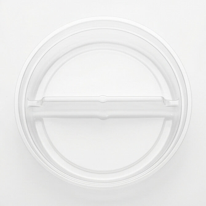 Clear round 2-compartment insert viewed from directly above, showing the central divider splitting the tray into two sections on a white background
