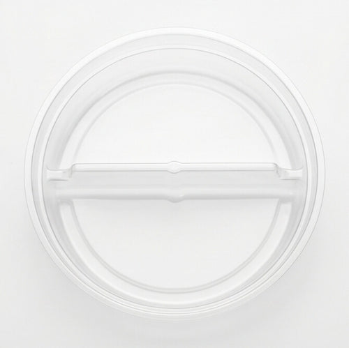Clear round 2-compartment insert viewed from directly above, showing the central divider splitting the tray into two sections on a white background