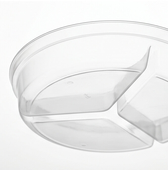 Clear round 3-compartment insert viewed from a low angle, emphasizing the depth of the compartments and the dividing walls.