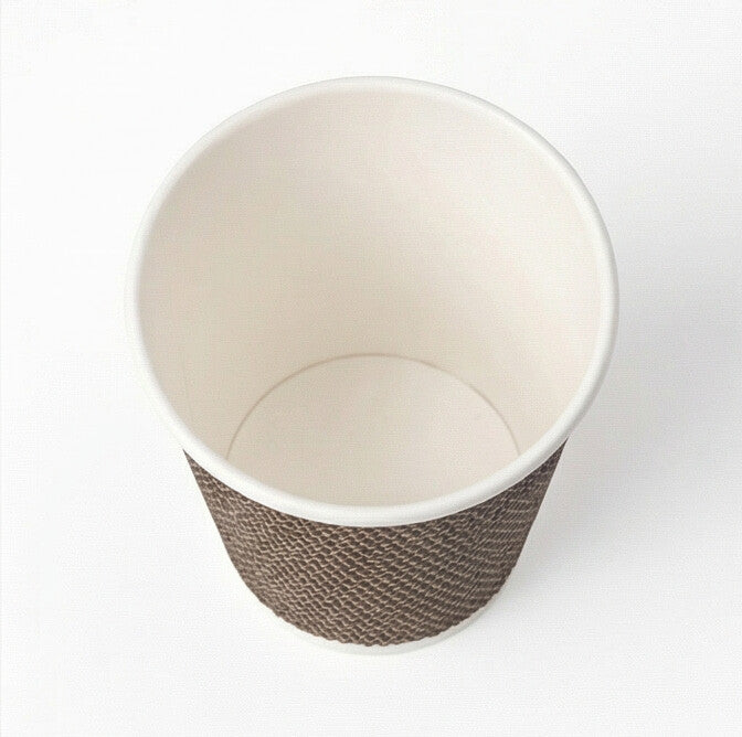 Overhead view into the open interior of a 4oz VIP Ripple Wall Paper Cup, smooth white inner wall, woven exterior rim