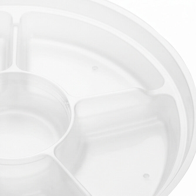 Close-up of the wedge compartments and central round well of a clear round 6-compartment insert, showing the molded dividing walls