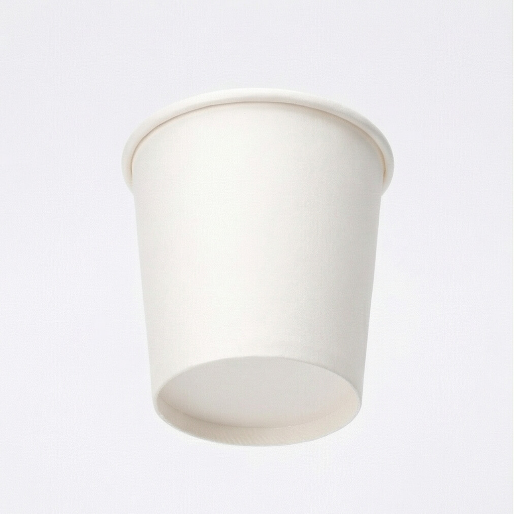 Low-angle front shot of a white single wall paper cup on a light grey background, emphasising the tapered body and base