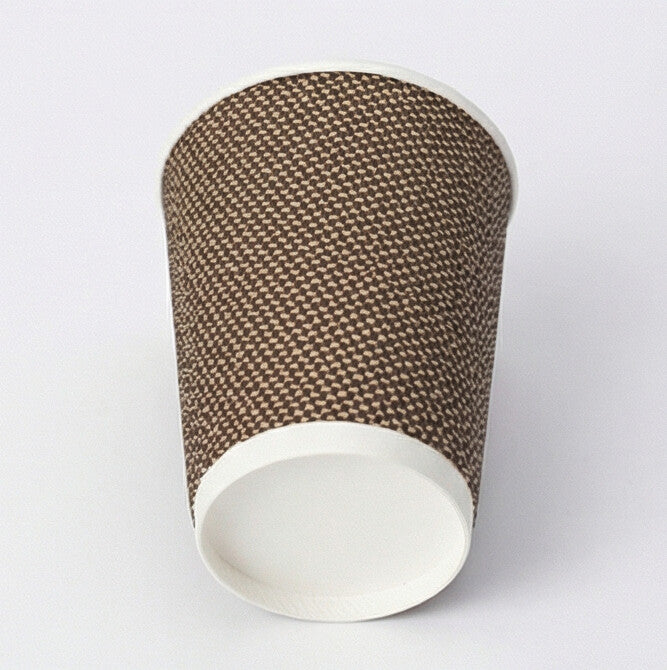 8oz VIP ripple wall paper cup tilted to show the base ring from low angle, woven exterior on light grey