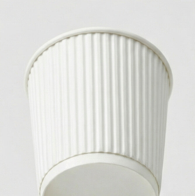 Close-up from above of the rim and white vertical ripple texture of an 8oz ripple wall paper cup, light grey