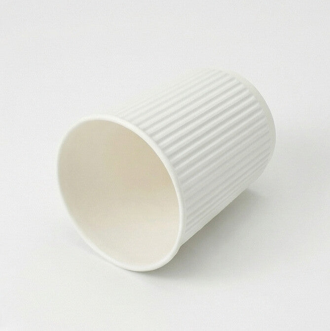 8oz white ripple wall paper cup tipped on its side showing the interior opening and ripple exterior on white