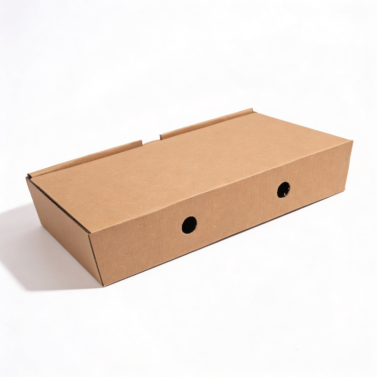 Fish and chips box closed, three-quarter angle view showing natural kraft brown corrugated construction with ventilation holes on side panels on white background