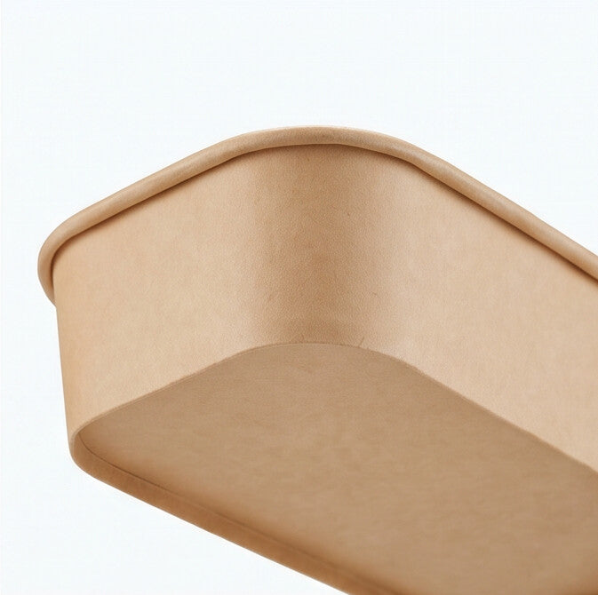 Close-up of the smooth interior wall and base corner of a kraft rectangular paper bowl 500ml, showing the food-grade paper lining.