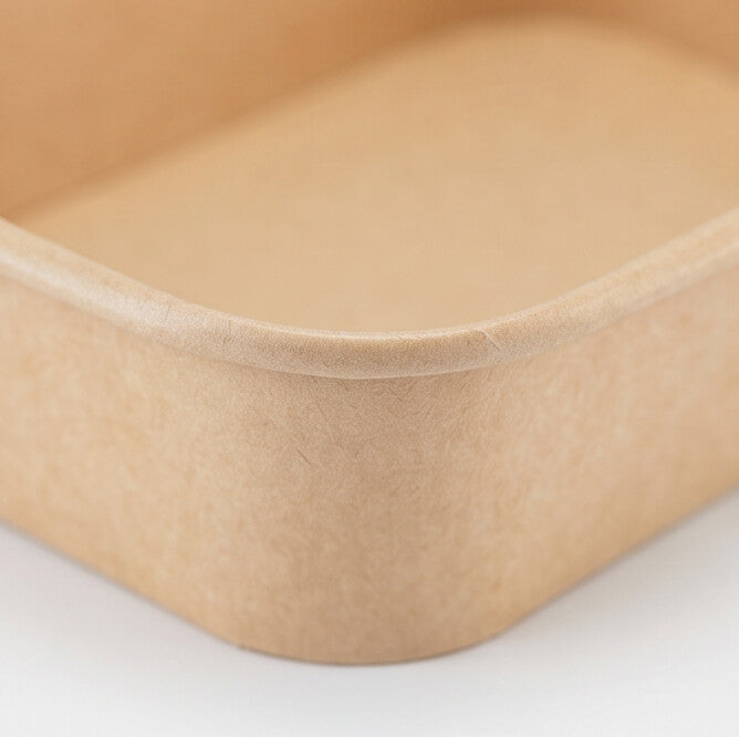 Close-up of the rolled rim and rounded corner of a kraft rectangular paper bowl 500ml, highlighting the textured kraft paper finish.