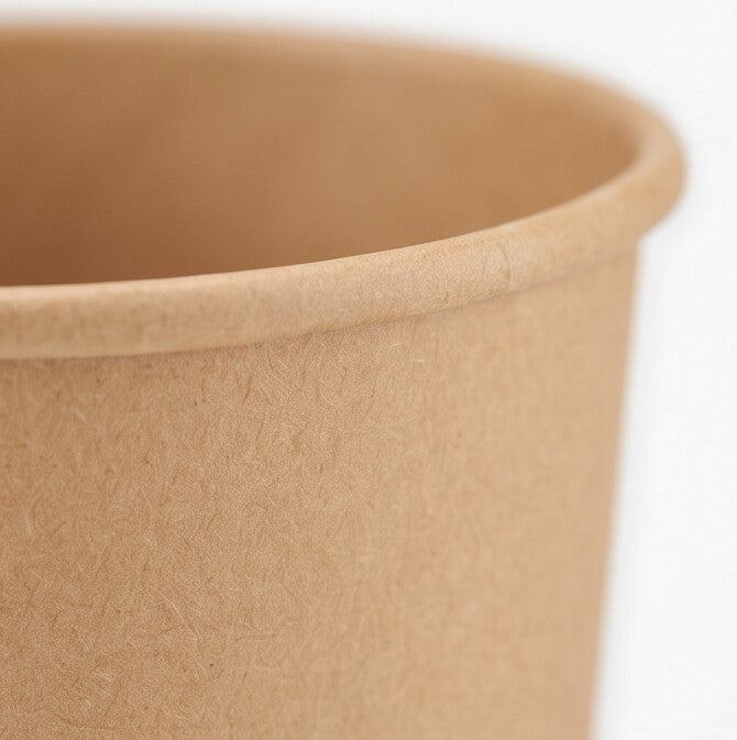 Close-up of the rolled rim and textured kraft paper sidewall of an 8oz soup container, showing the natural recycled paper grain.

