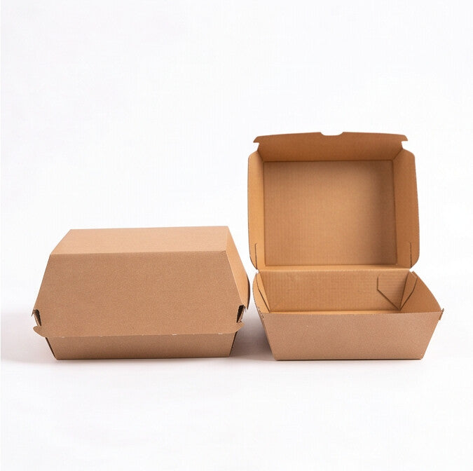 Medium corrugated burger boxes, straight front view showing one closed box and one open box side by side, natural kraft brown corrugated construction on white background