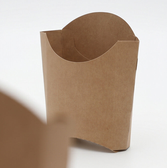 Medium kraft chip scoop, three-quarter angle close-up view showing assembled upright scoop with curved opening and natural kraft brown construction on white background