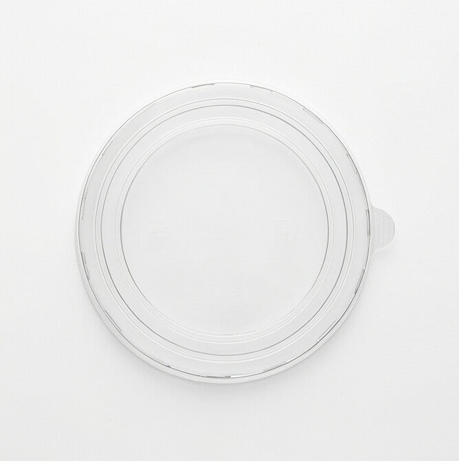 Clear 183mm PET lid viewed from directly above, showing the flat transparent top, concentric rings and side pull tab on a white background