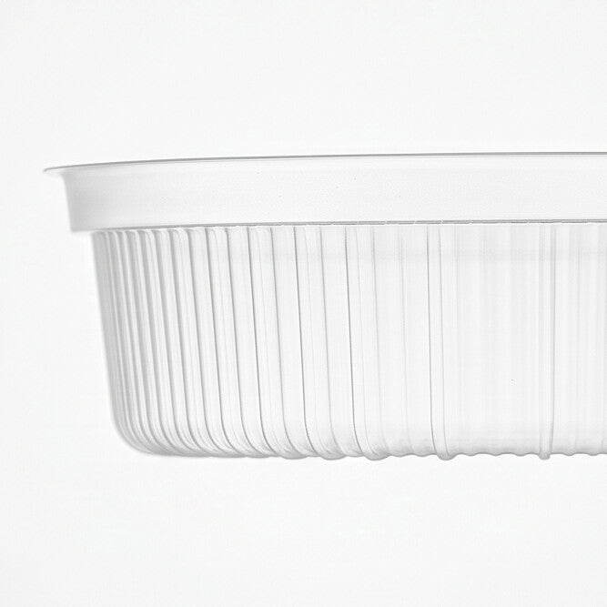 Close-up of the vertical fluting and rolled rim of a clear PP soup bowl insert, highlighting the ribbed wall texture.