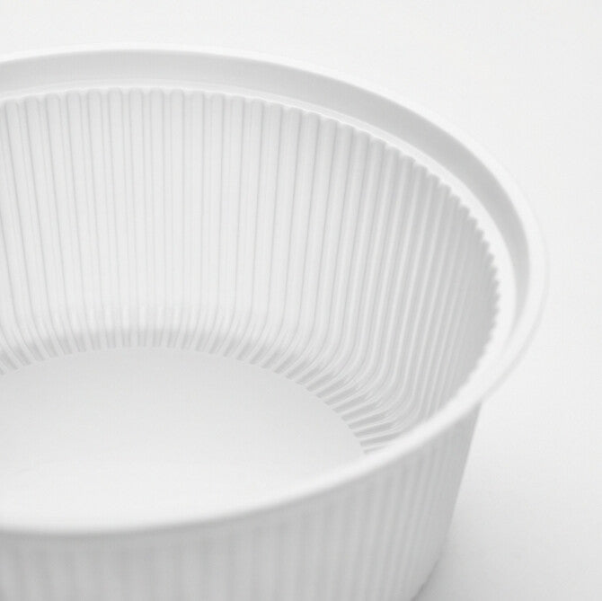 Close-up of the deep fluted interior wall and rolled rim of a clear PP soup bowl insert.
