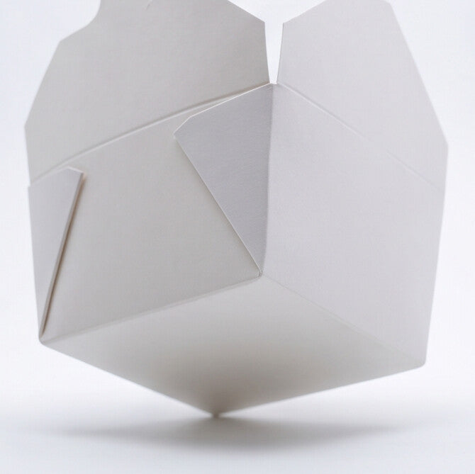 White paper takeaway food container No. 1 open, low perspective view showing folded corner construction and open flap design