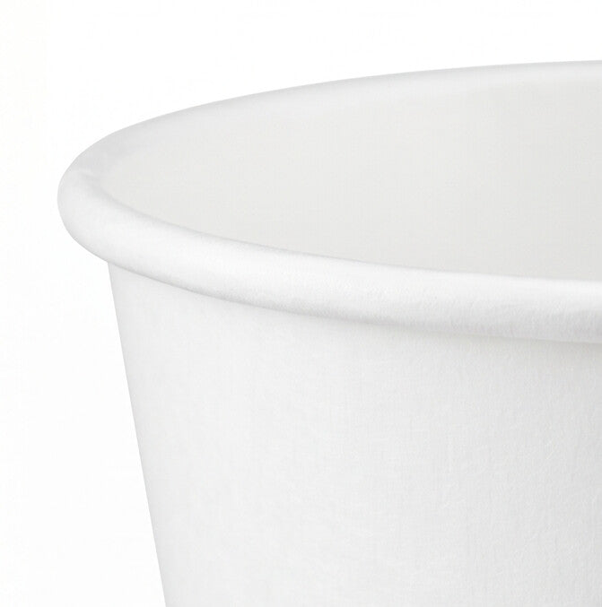 Close-up of the rolled rim and interior wall of a white paper soup bowl 54oz, highlighting the smooth food-grade coated surface.