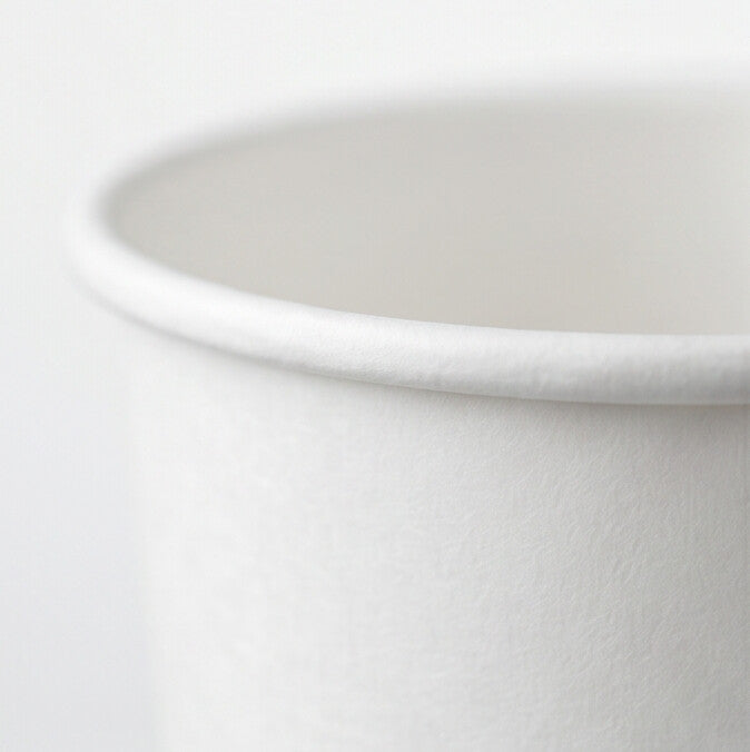 Close-up of the rolled rim and textured sidewall of a white paper soup container 16oz, highlighting the food-grade coated surface.