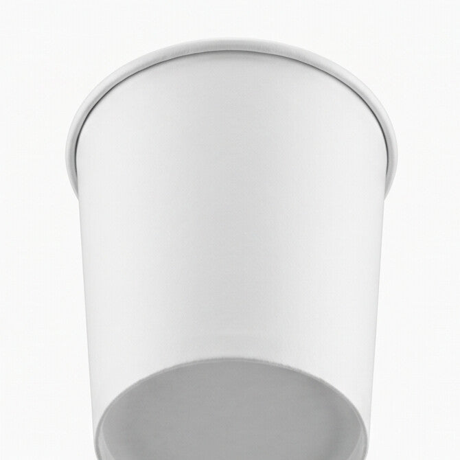 White paper soup container 32oz viewed from a low angle, emphasizing the tapered body, base and rolled rim.